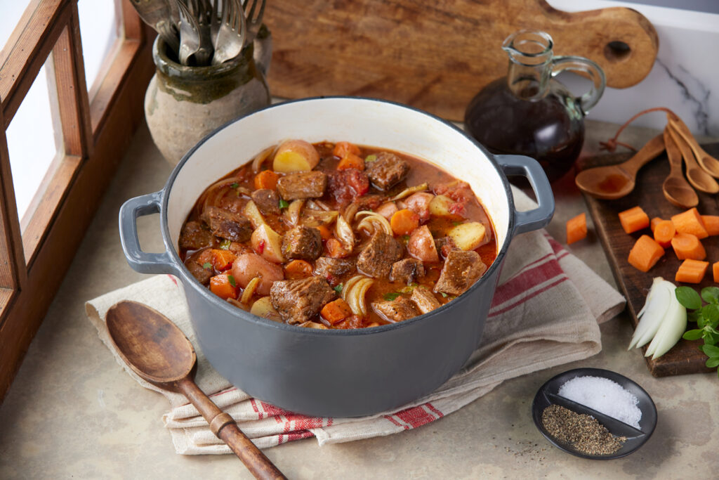Tomato Beef Stew in a pot on a table