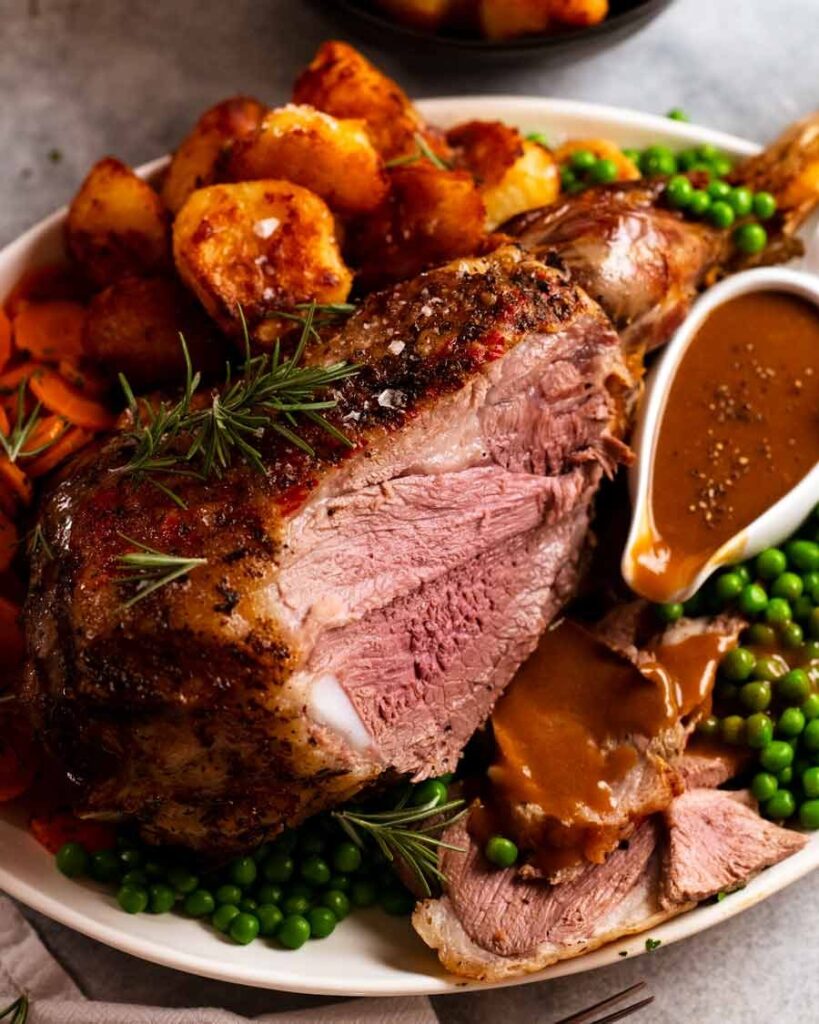 roast lamb with gravy peas and potatoes