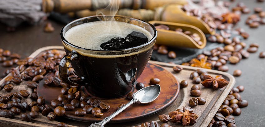 black coffee with coffee beans