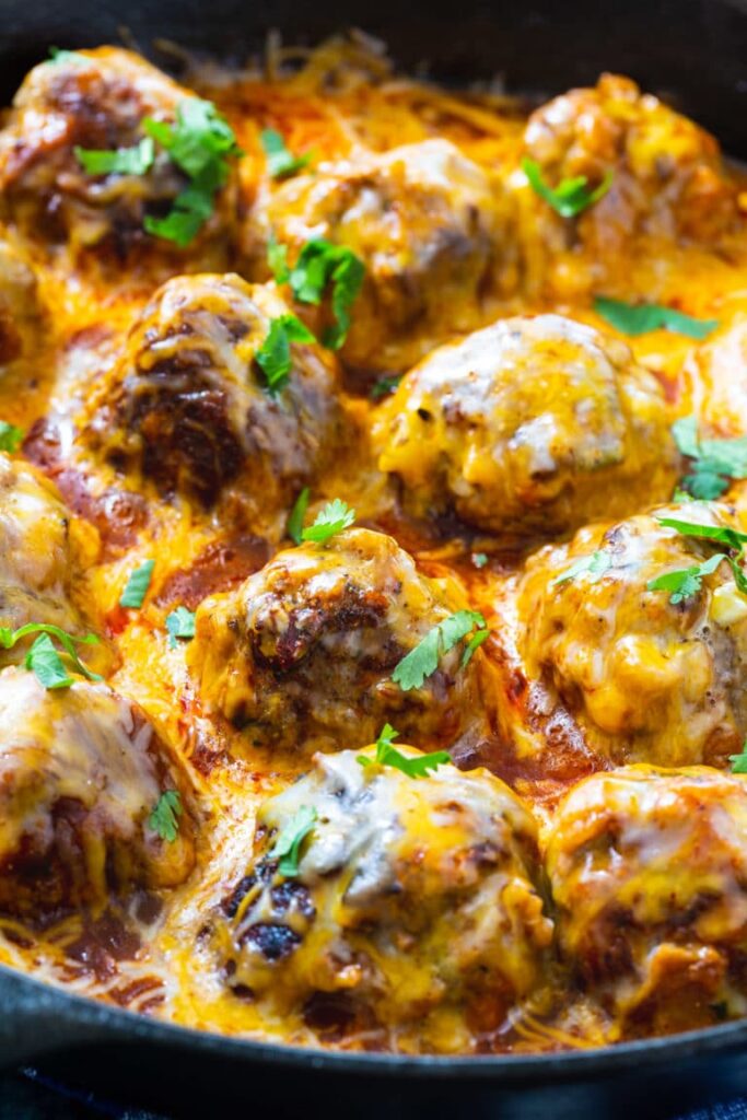 Easy spicy tex mex meatballs topped with melted cheese ready in 45 minutes perfect for weeknight dinner.